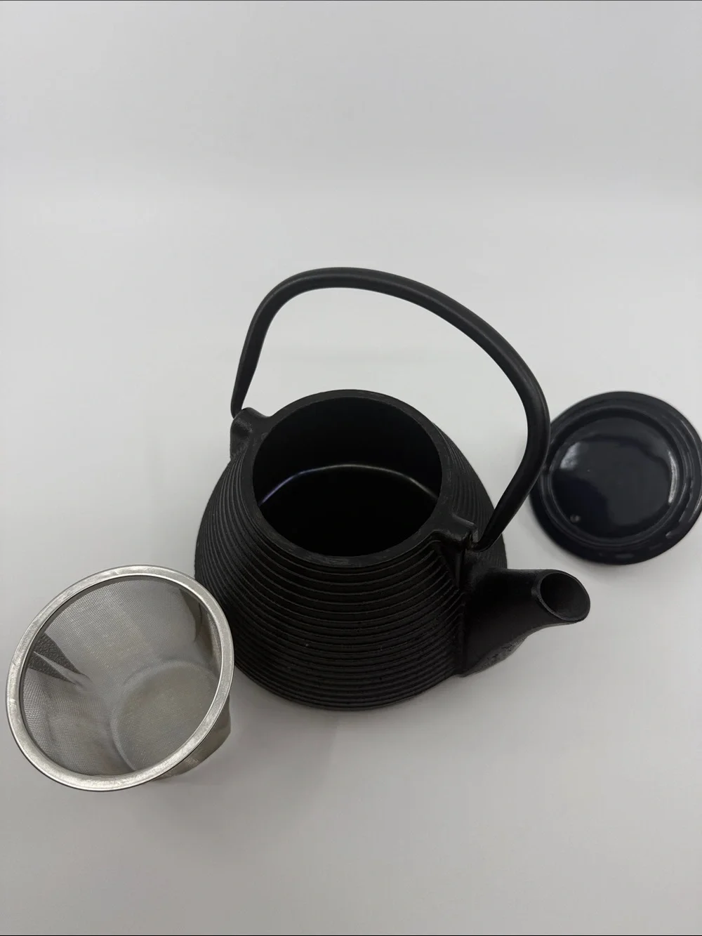 Elegant Black Cast Iron Teapot with Textured Finish